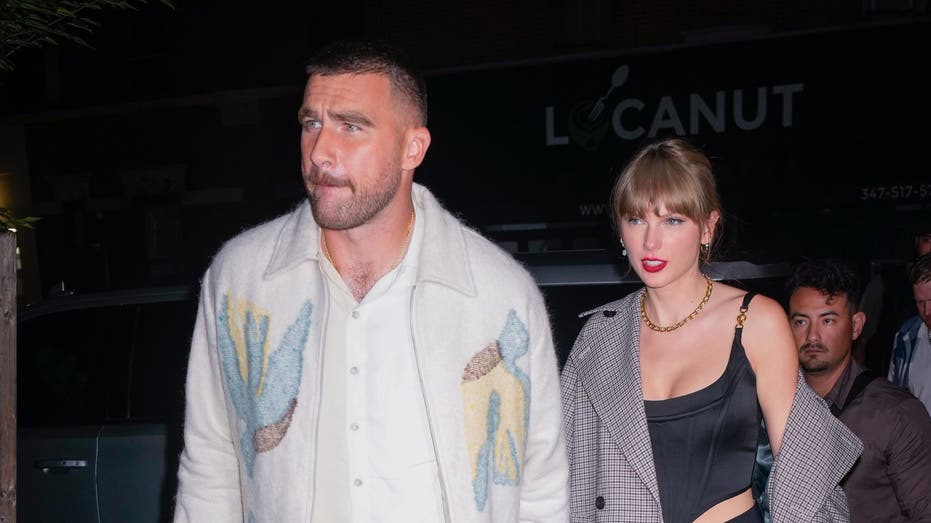 Taylor Swift and Travis Kelce holding hands