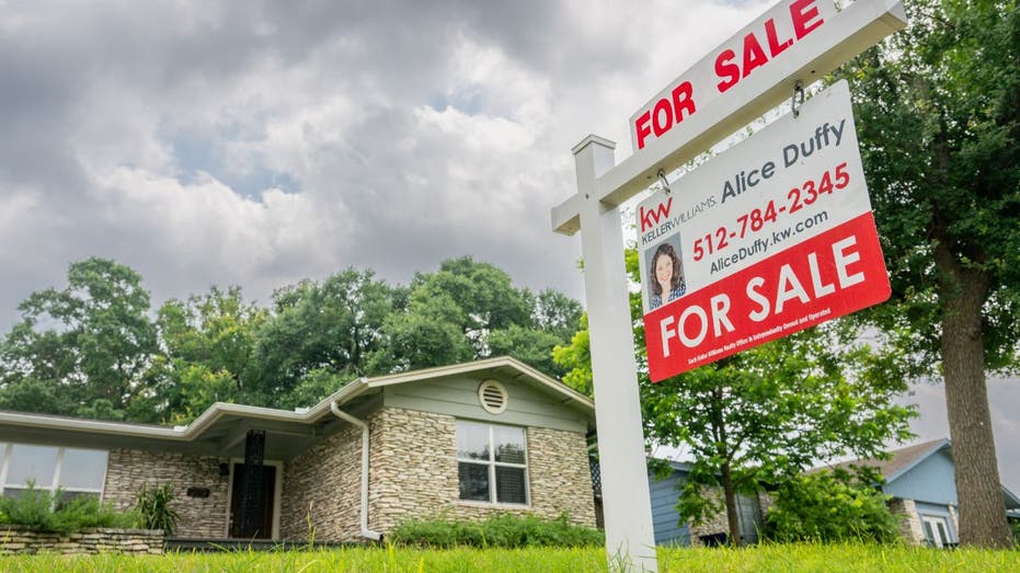 home for sale with clouds overhead